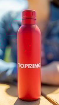 white logo on red bottle