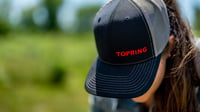 red logo on black cap